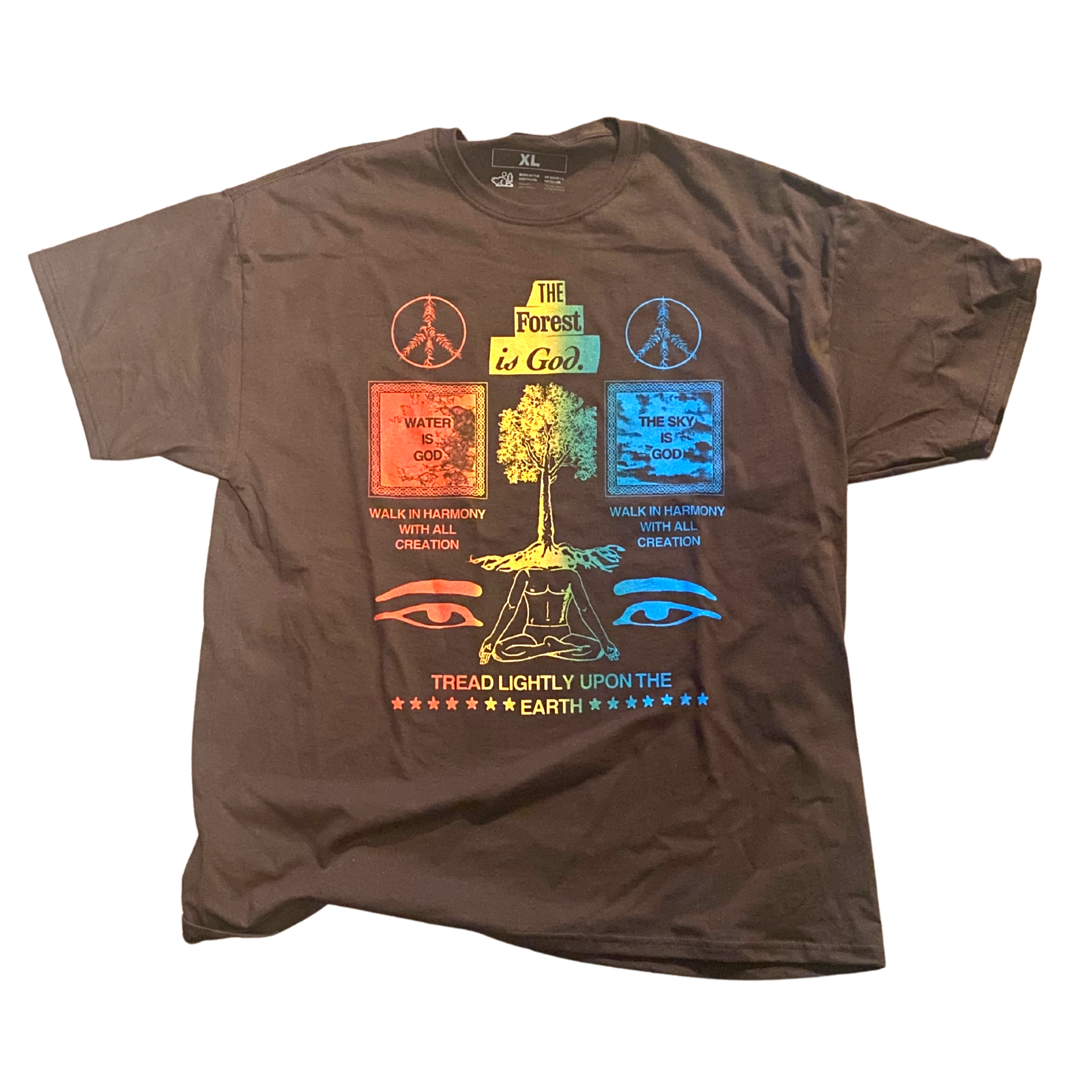 A brown t shirt with a design printed in a gradient of red,yellow,green,and blue. The shirt says" The forest is god. walk in harmony with all creation. Tread lightly upon the earth."
